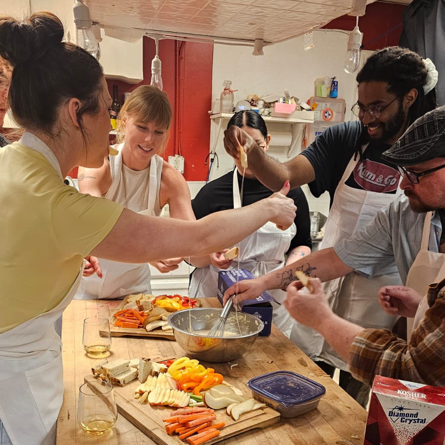 guests cooking and eating fondue together at Pickwick & Cherry